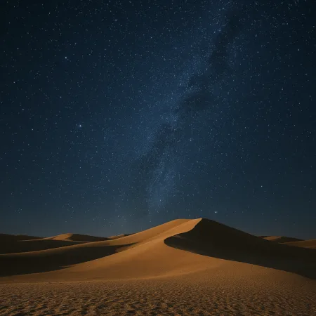 Céu estrelado visto de um deserto com dunas e muitos grãos de areia iluminadas pela luz natural
